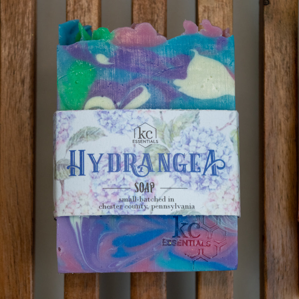 Swirls of purple, pink, white, blue and green in the artisan soap bar.