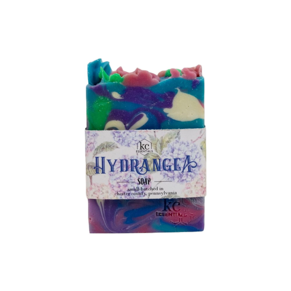 Swirls of purple, pink, white, blue and green in the artisan soap bar.