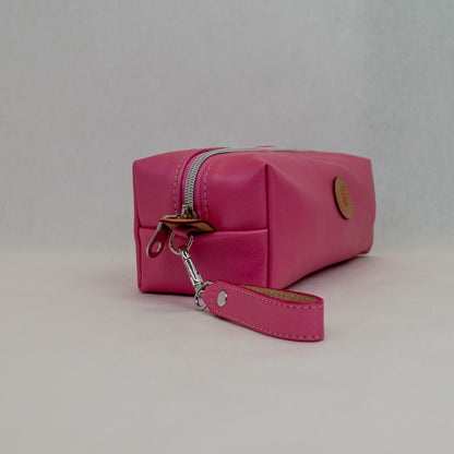 Side view of T5 bath dopp kit toiletry wash bag designer handcrafted of smooth calf leather in frosted pink.