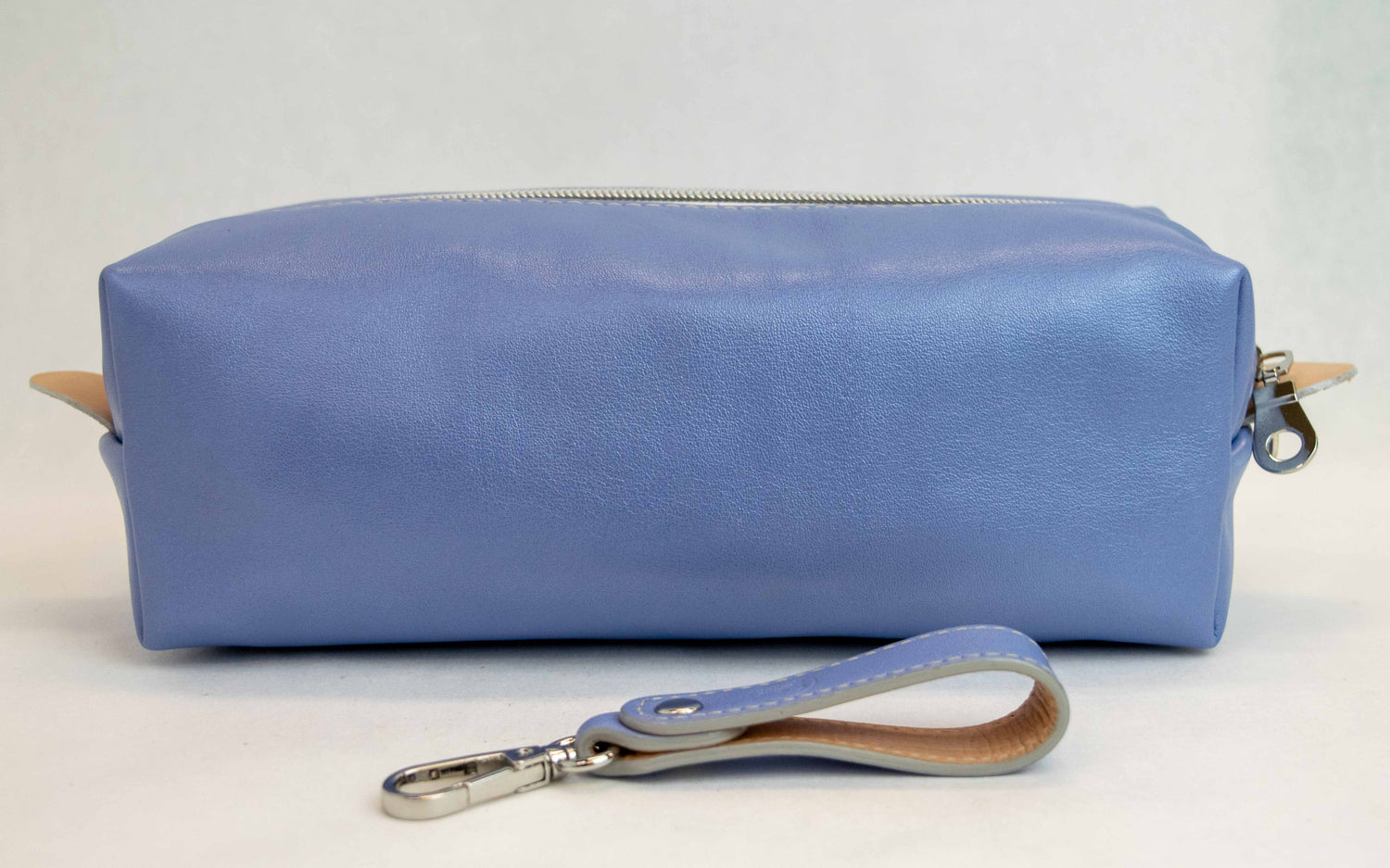 Back view of T5 bath dopp kit toiletry wash bag designer handcrafted of smooth calf leather in light Periwinkle blue.
