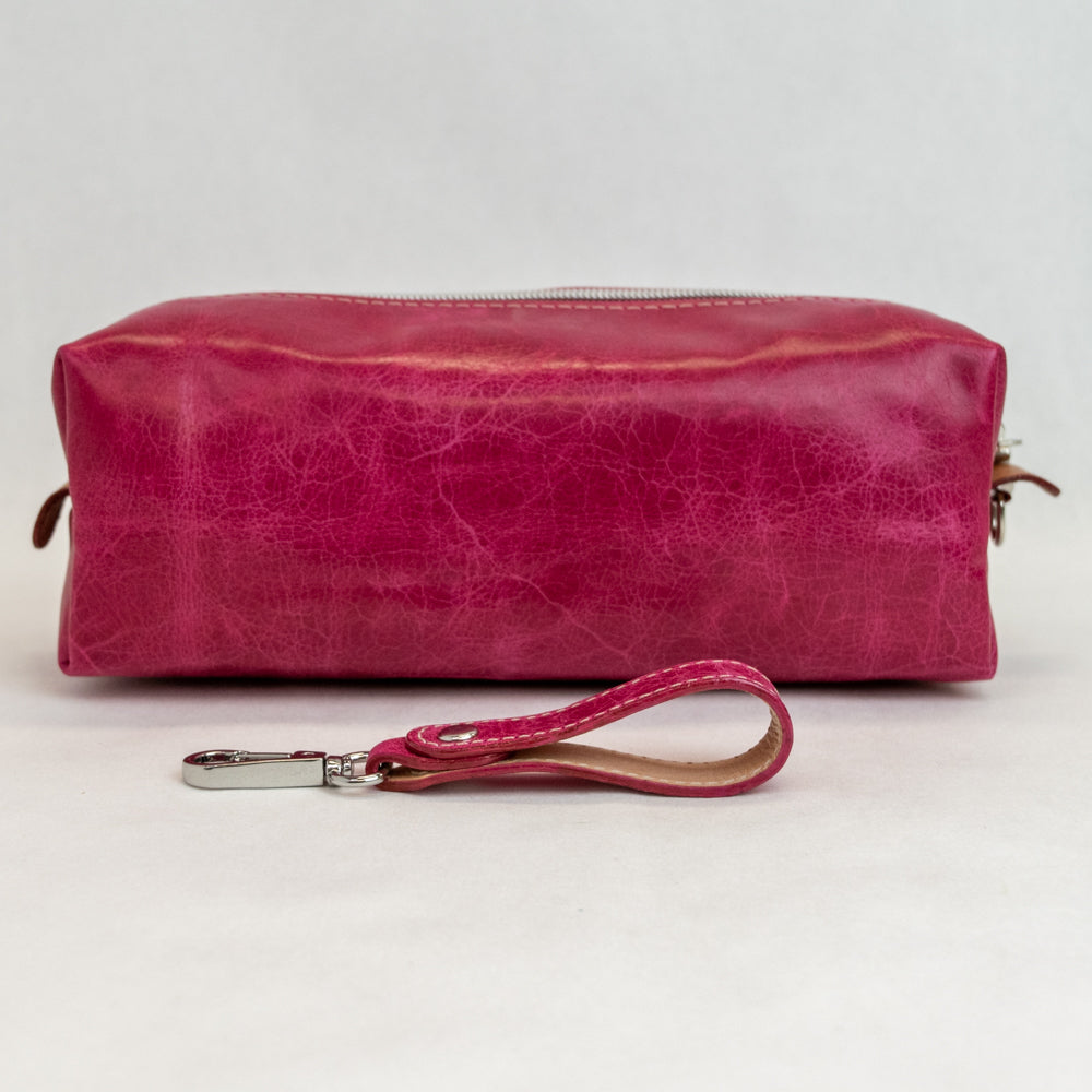 Back view of T5 bath dopp kit toiletry wash bag designer handcrafted of smooth calf leather in hot Barbie pink.