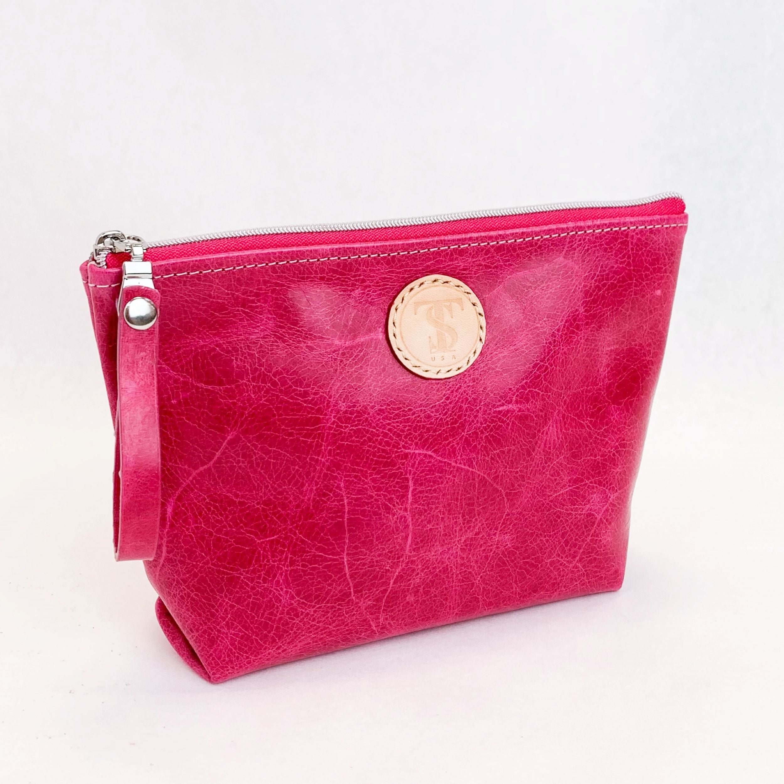 Front view T5 Cosmetics case toiletry bag designer handcrafted in smooth calf leather in hot Barbie pink.
