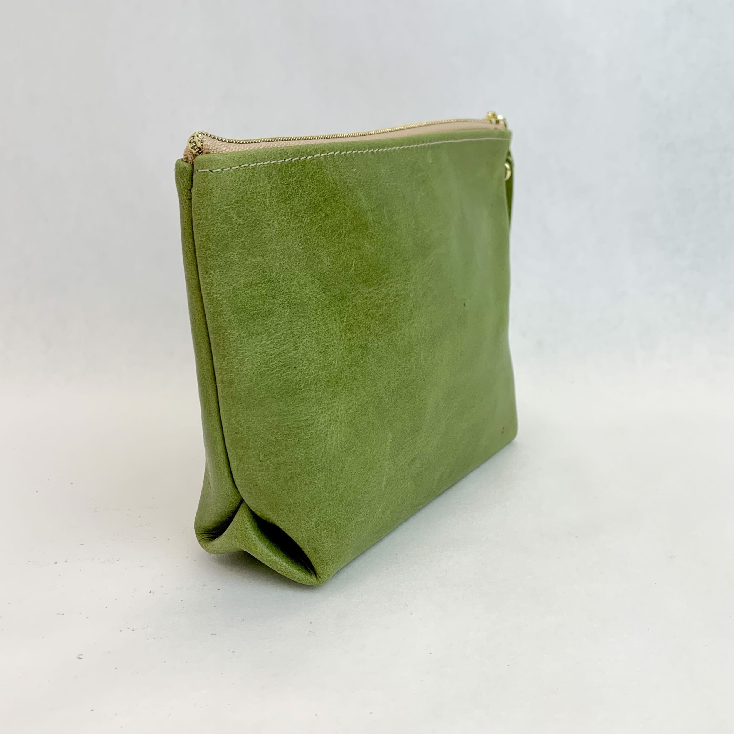 Side view T5 Cosmetics case toiletry bag designer handcrafted in smooth calf leather in aloe green.