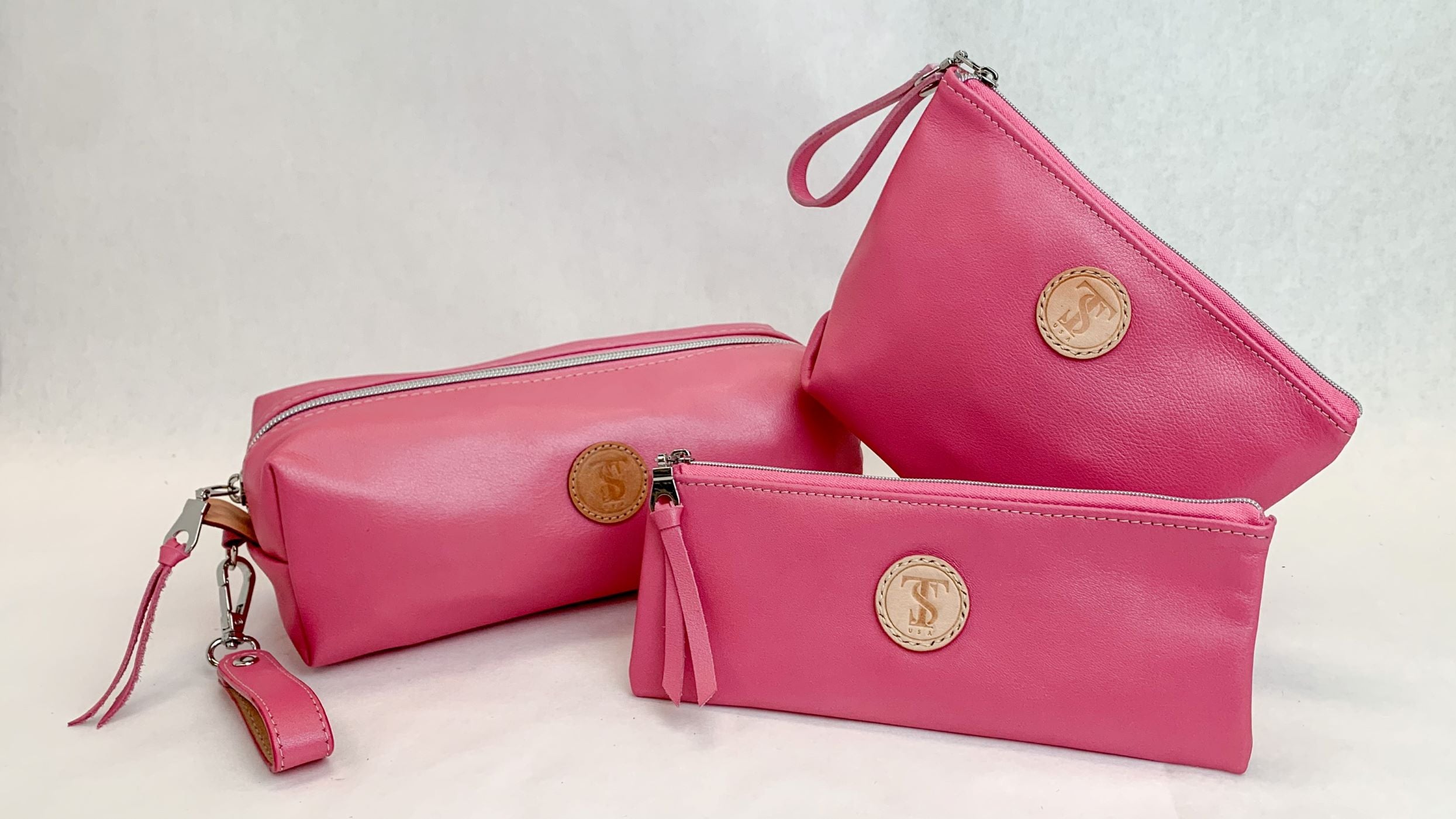 T5 Cosmetic cases in Barbie pink calf leather.