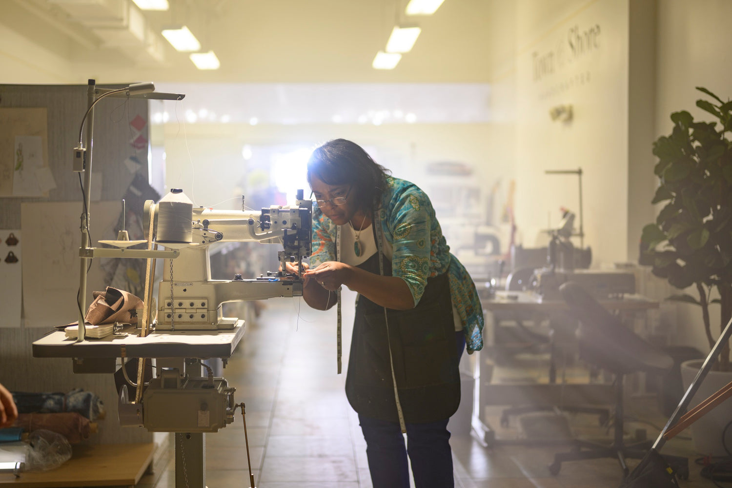 Designer Liv McClintock preparing sewing machine in her studio. Photo Credits: Moonloop Photograpy_Scott Ciancio