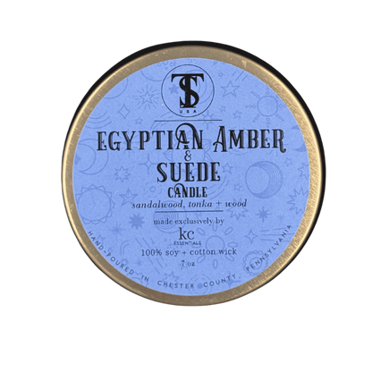 Label view of Town &amp; Shore Handcrafted  Egyptian Amber &amp; Suede Candle in Bronze Metal Tin with Lid. Photo property of Town &amp; Shore Apparel, All rights reserved