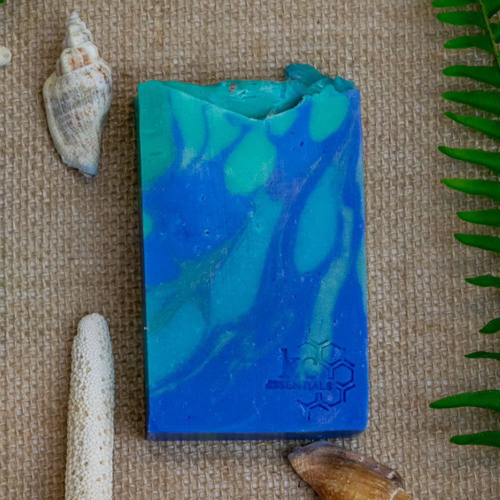 Swirls of blue green and teal shape waves in this artisan bar soap