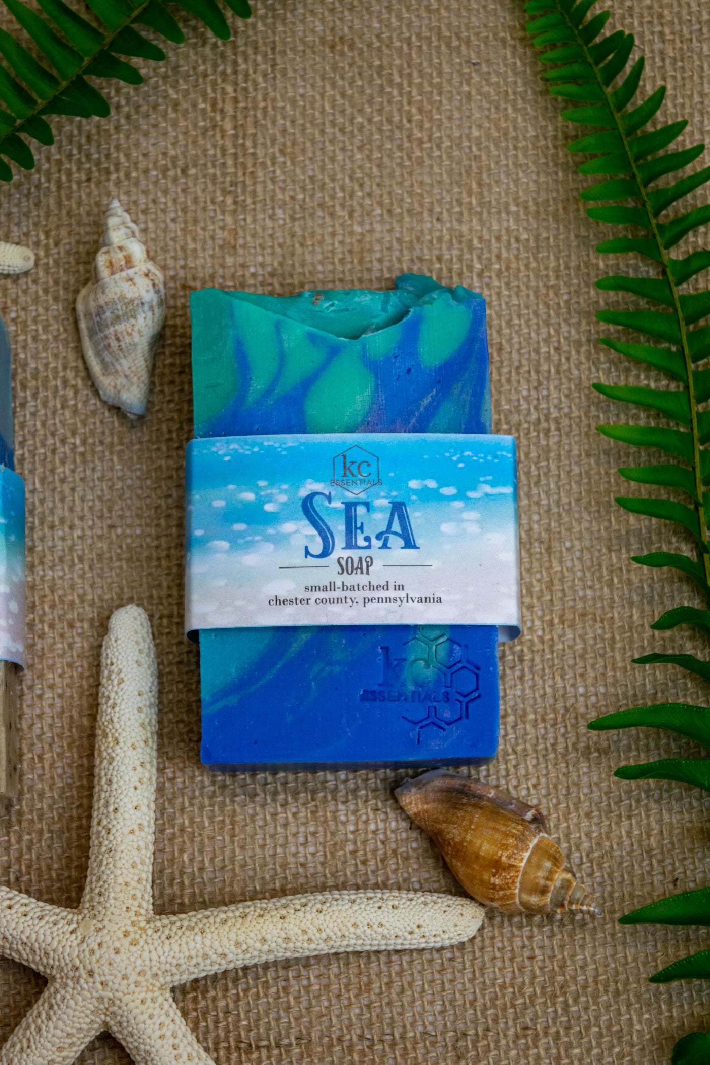 Swirls of blue green and teal shape waves in this artisan bar soap