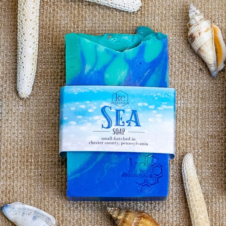 Swirls of blue green and teal shape waves in this artisan bar soap