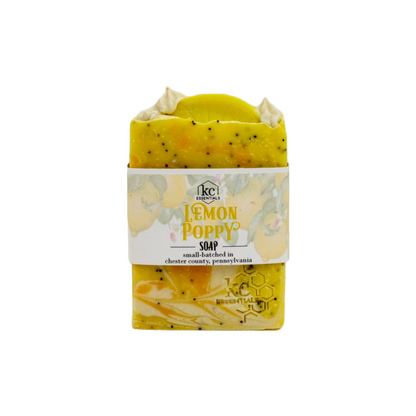 Sunny bright shades of yellow, gold and cream blended with dark poppy seeds and topped with a lemon slice shape, makeup the beautiful artisanal bar soap.