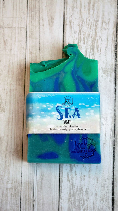 Swirls of blue green and teal shape waves in this artisan bar soap