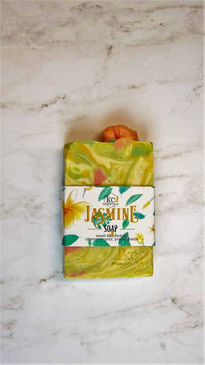 Swirls of yellow, green and orange in the marbled artisan soap bar.