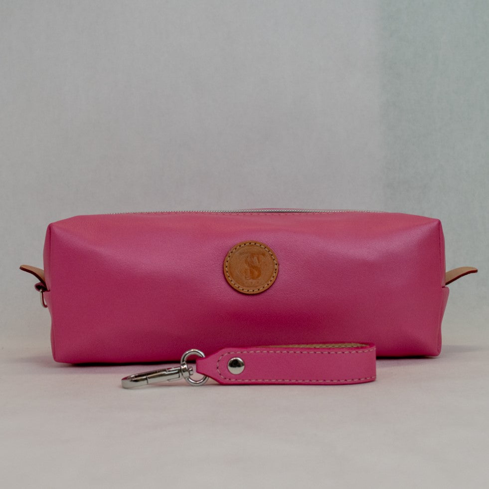 Front view of T5 bath dopp kit toiletry wash bag designer handcrafted of smooth calf leather in frosted pink.