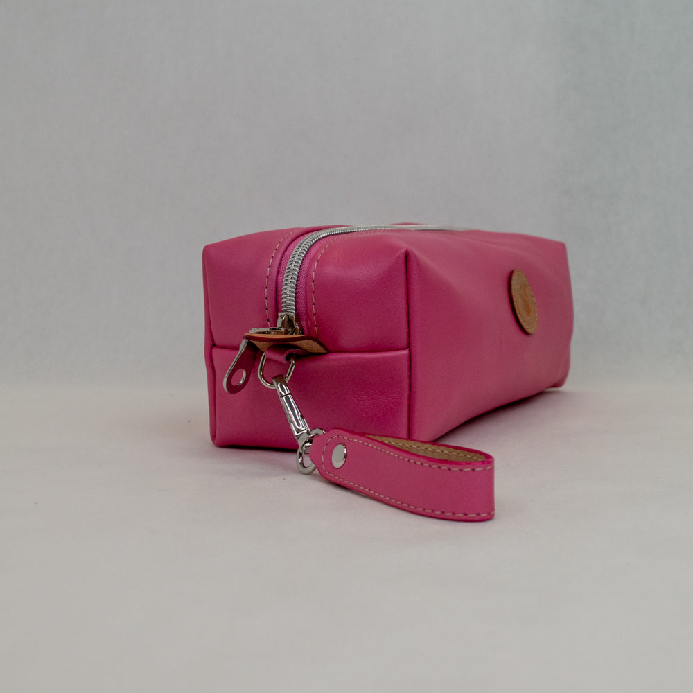 Side view of T5 bath dopp kit toiletry wash bag designer handcrafted of smooth calf leather in frosted pink.