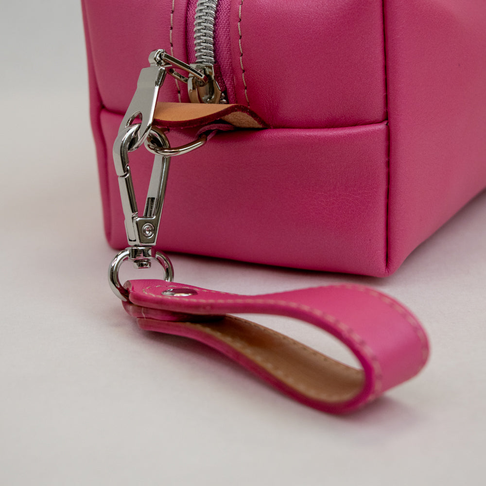 Closeup of view of T5 bath dopp kit toiletry wash bag designer handcrafted of smooth calf leather in frosted pink.