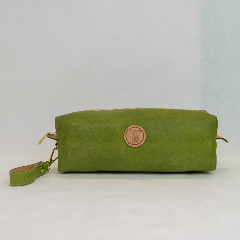 Front view of T5 bath dopp kit toiletry wash bag designer handcrafted of smooth calf leather in vintage aloe green.