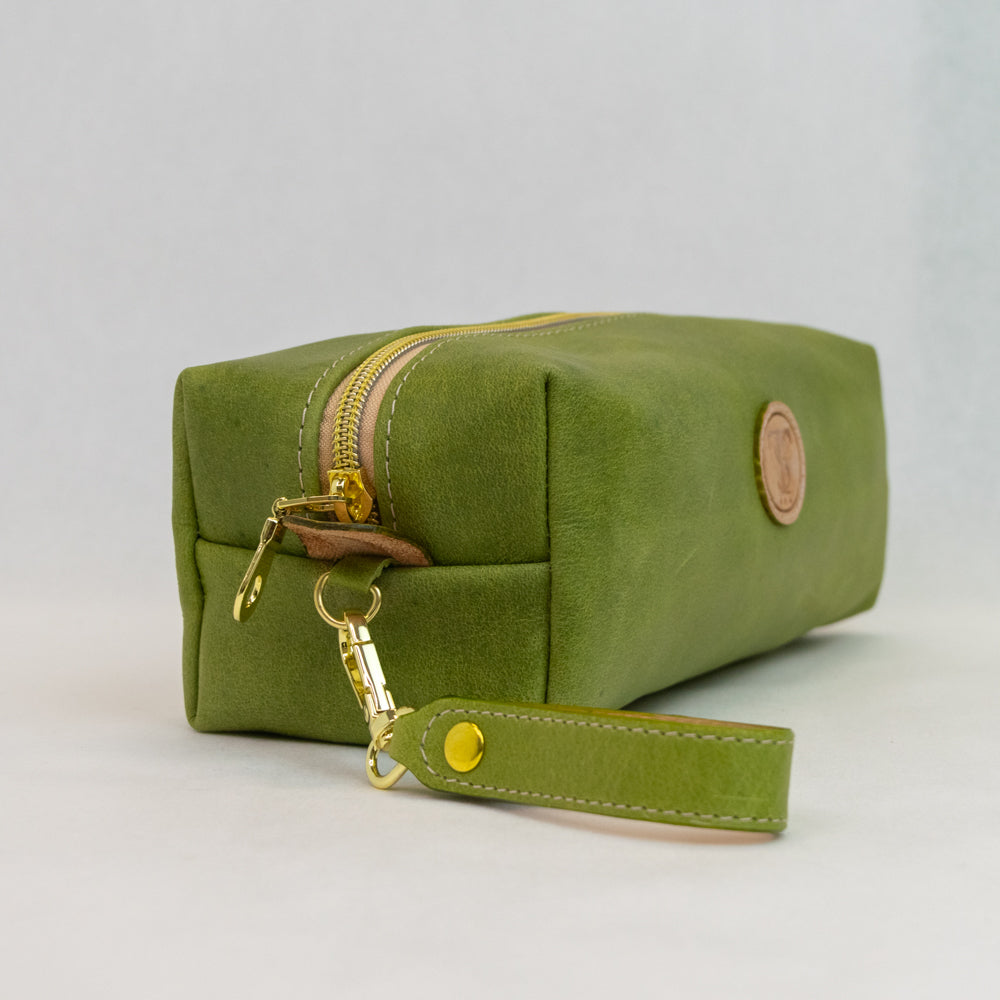 Side view of T5 bath dopp kit toiletry wash bag designer handcrafted of smooth calf leather in vintage aloe green.