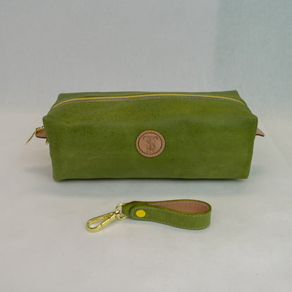 Front view of T5 bath dopp kit toiletry wash bag designer handcrafted of smooth calf leather in vintage aloe green.