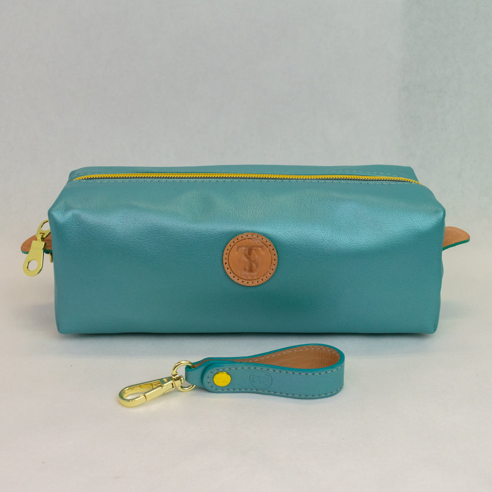 Front view of T5 bath dopp kit toiletry wash bag designer handcrafted of smooth calf leather in frosted turquoise.