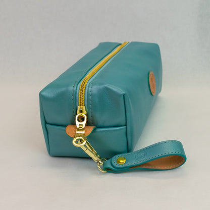 Side view of T5 bath dopp kit toiletry wash bag designer handcrafted of smooth calf leather in frosted turquoise..