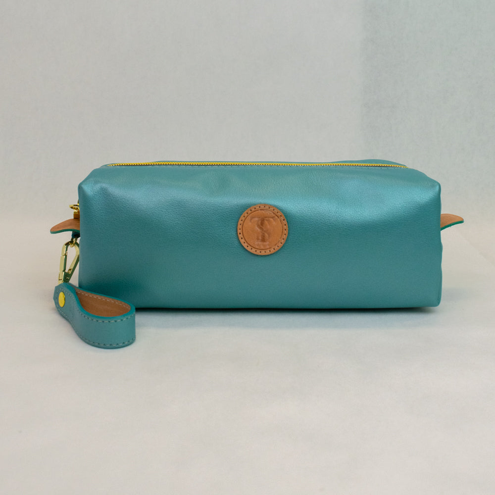 Front view of T5 bath dopp kit toiletry wash bag designer handcrafted of smooth calf leather in frosted turquoise..
