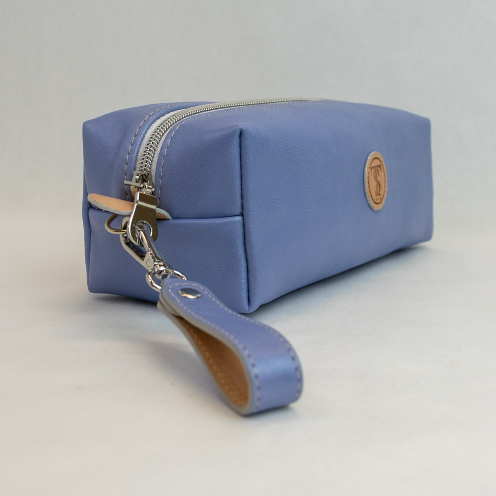 Side view of T5 bath dopp kit toiletry wash bag designer handcrafted of smooth calf leather in light Periwinkle blue.