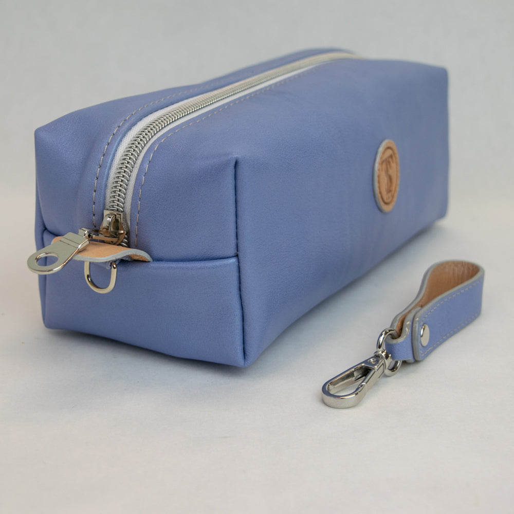 Side view of T5 bath dopp kit toiletry wash bag designer handcrafted of smooth calf leather in light Periwinkle blue.