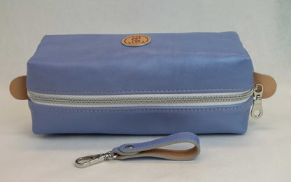 Top view of T5 bath dopp kit toiletry wash bag designer handcrafted of smooth calf leather in light Periwinkle blue.