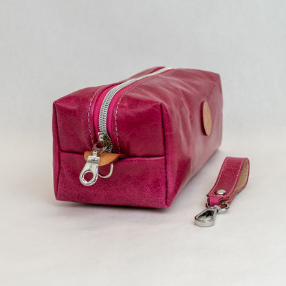 Side view of T5 bath dopp kit toiletry wash bag designer handcrafted of smooth calf leather in hot Barbie pink.