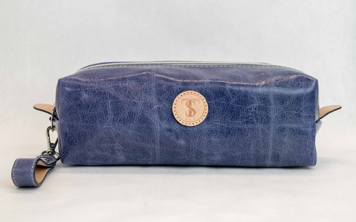 Front view of T5 bath dopp kit toiletry wash bag designer handcrafted of smooth calf leather in Atlantic denim blue