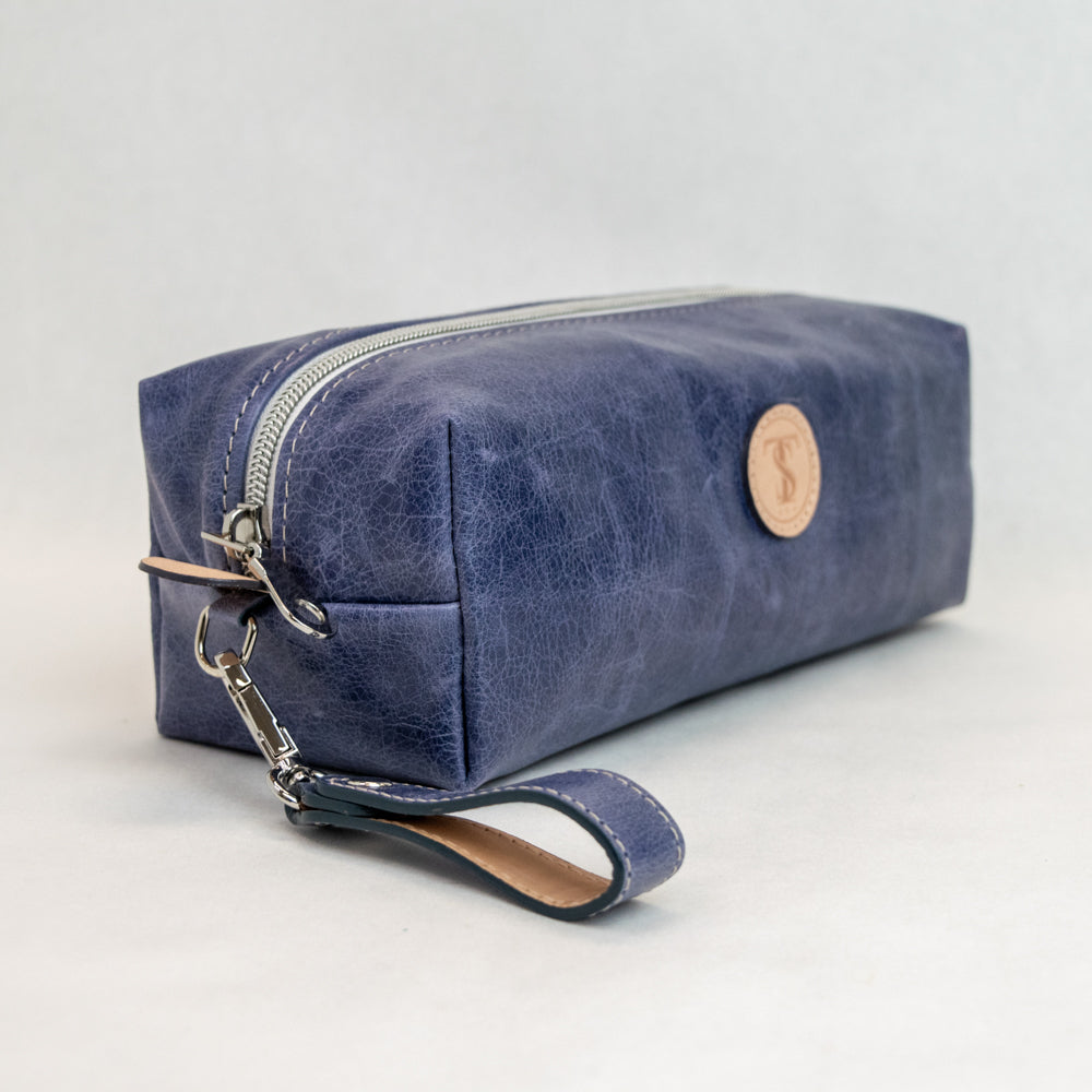 Side view of T5 bath dopp kit toiletry wash bag designer handcrafted of smooth calf leather in Atlantic denim blue