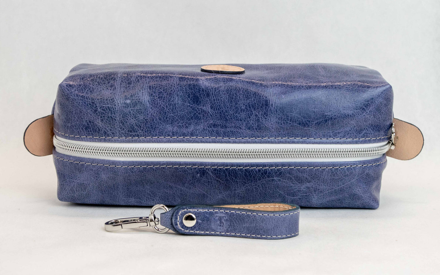 Top view of T5 bath dopp kit toiletry wash bag designer handcrafted of smooth calf leather in Atlantic denim blue