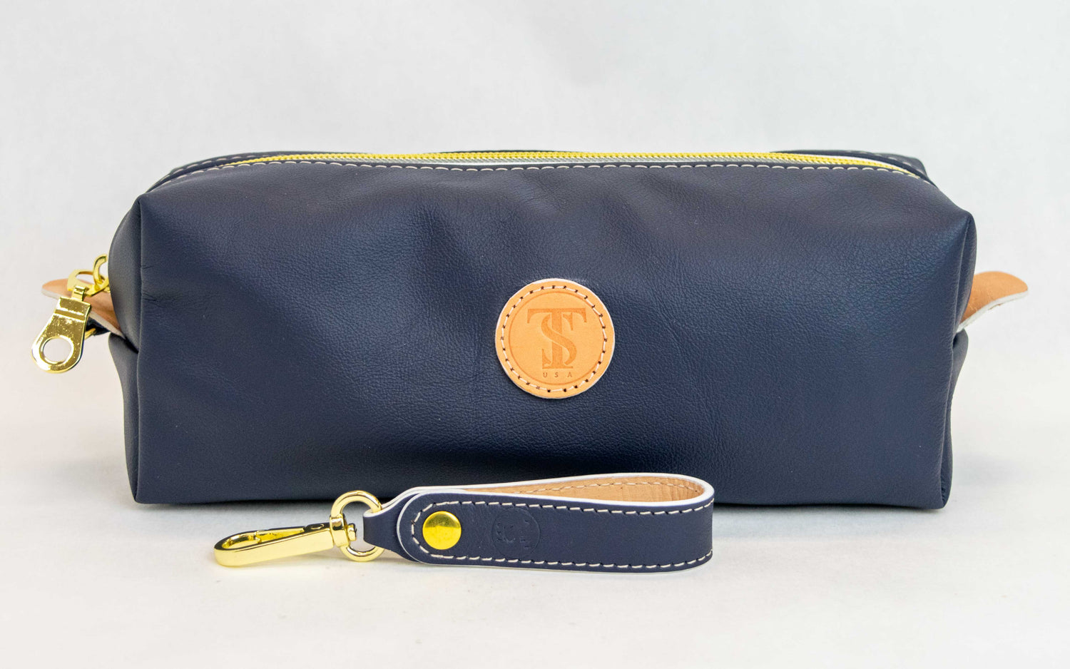 Front view of T5 bath dopp kit toiletry wash bag designer handcrafted of smooth calf leather in nautical navy blue.