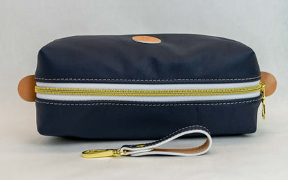 Top view of T5 bath dopp kit toiletry wash bag designer handcrafted of smooth calf leather in nautical navy blue.