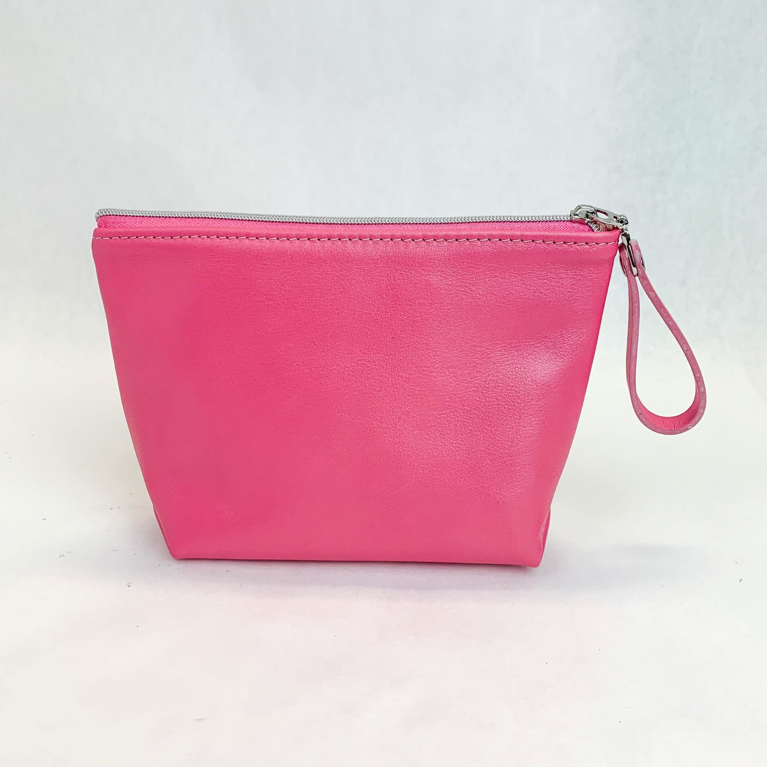 Back view T5 Cosmetics case toiletry bag designer handcrafted in smooth calf leather in frosted pink.