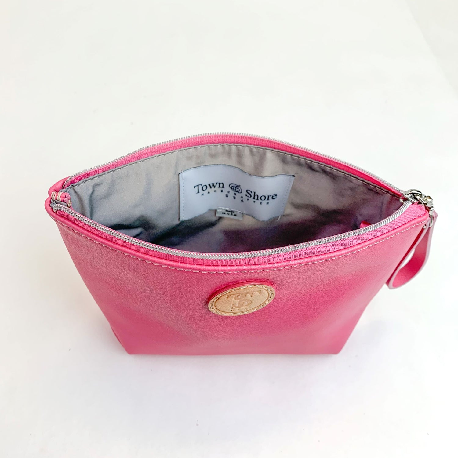 Inside view T5 Cosmetics case toiletry bag designer handcrafted in smooth calf leather in frosted pink.