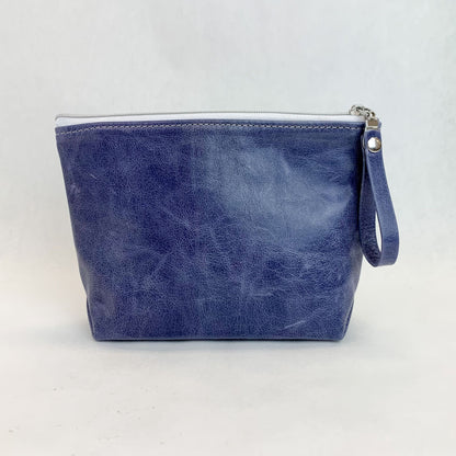 Back view T5 Cosmetics case toiletry bag designer handcrafted in smooth calf leather in denim blue.