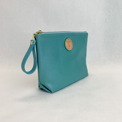 Side view T5 Cosmetics case toiletry bag designer handcrafted in smooth calf leather in turquoise.