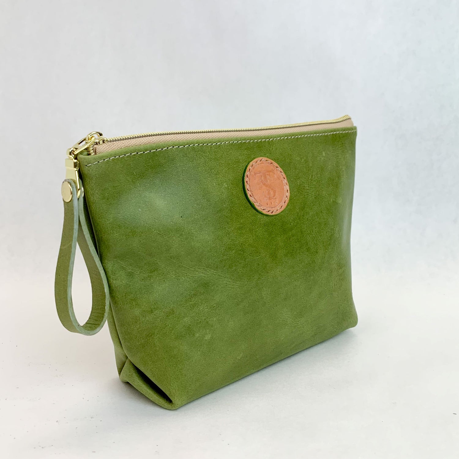 Side view T5 Cosmetics case toiletry bag designer handcrafted in smooth calf leather in aloe green.