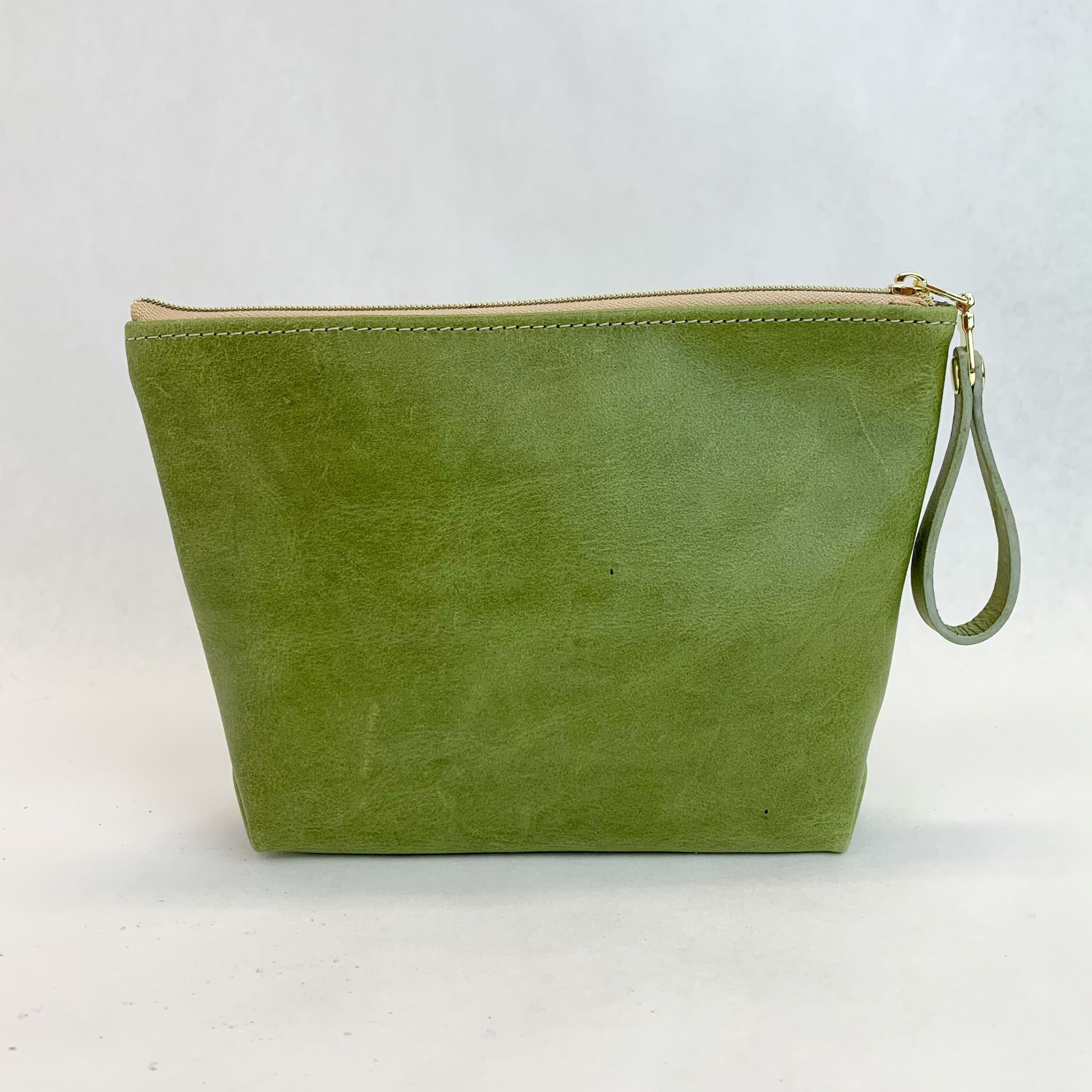 Back view T5 Cosmetics case toiletry bag designer handcrafted in smooth calf leather in aloe green.