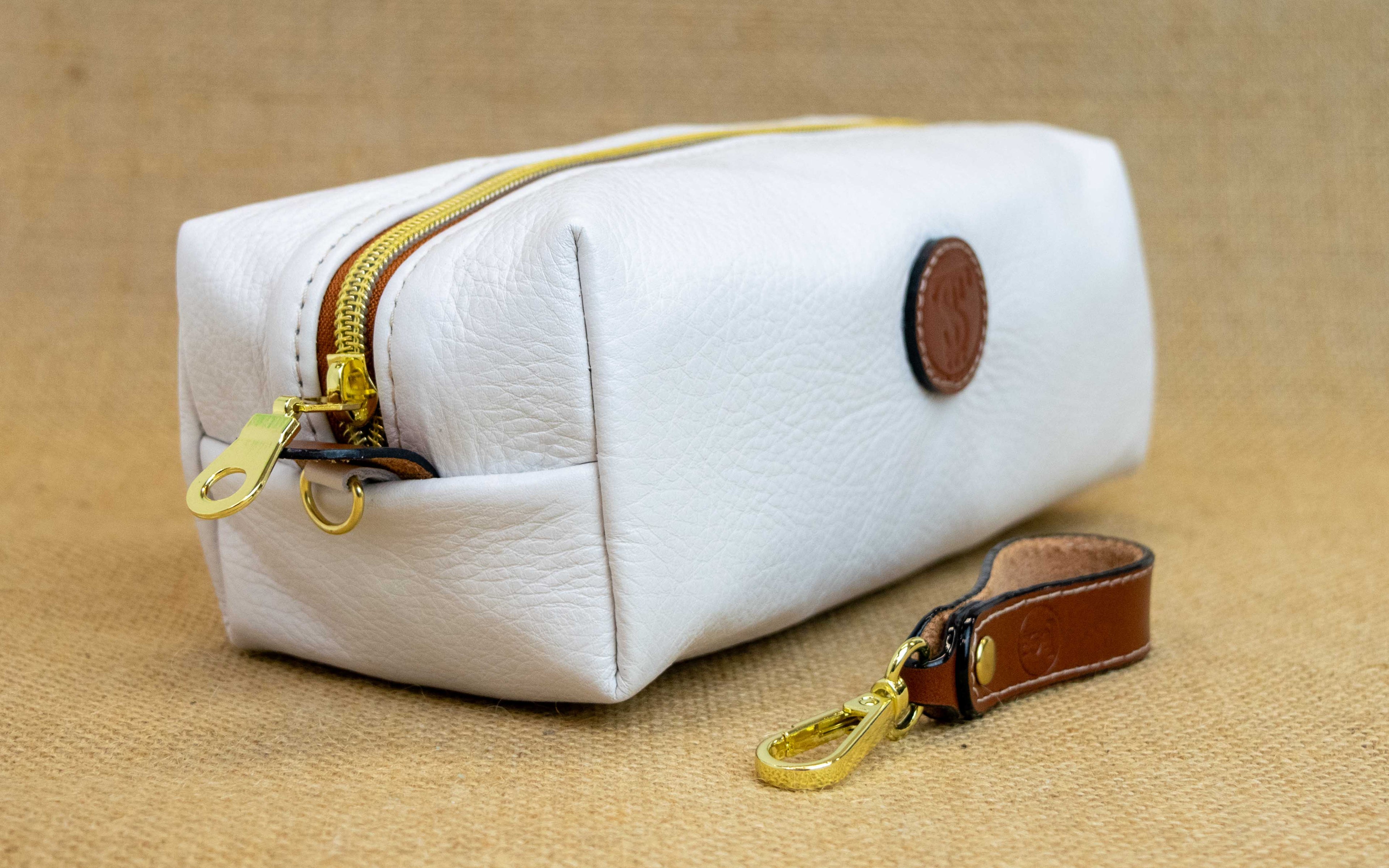 Side view of T5 bath dopp kit toiletry wash bag designer handcrafted of smooth calf leather in yacht white.