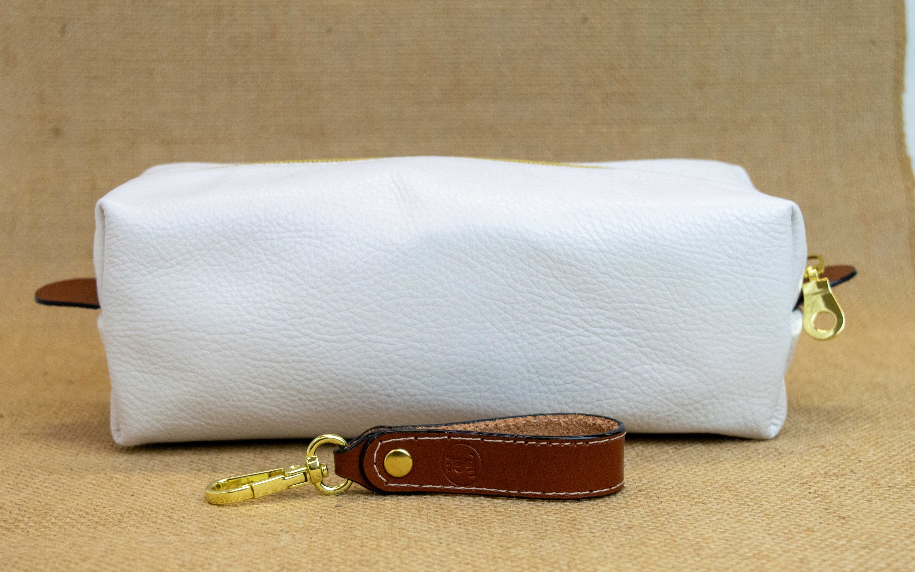 Back view of T5 bath dopp kit toiletry wash bag designer handcrafted of smooth calf leather in yacht white.