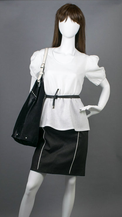 Model in white linen top wearing Leather hobo shoulder bag in jet black hair calf &amp; suede. Handcrafted by slow fashion indie designer Liv McClintock. Features hand laced white leather trim. Made in Wilmington Delaware USA.