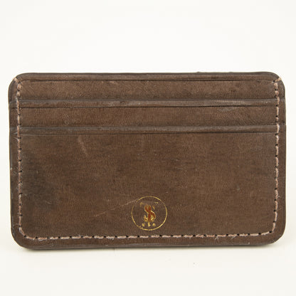 Front view of Distressed finish Chocolate brown leather slim card case with two front pockets center pocket gold brand logos on front 