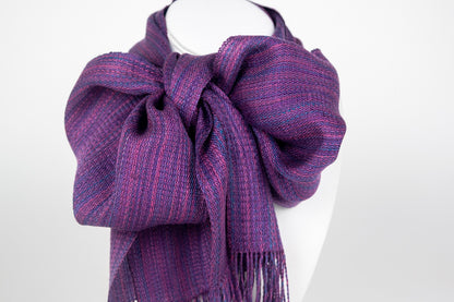 Handwoven scarf in rich varigated colors of purple, pink and blue with fringe on end