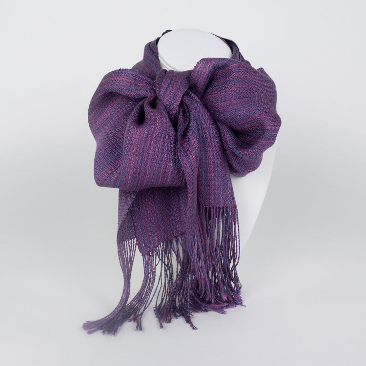 Handwoven scarf in rich varigated colors of purple, pink and blue with fringe on end
