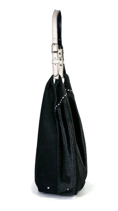 Side of Leather hobo shoulder bag in jet black hair calf &amp; suede. Handcrafted by slow fashion indie designer Liv McClintock. Features hand laced white leather trim. Made in Wilmington Delaware USA.